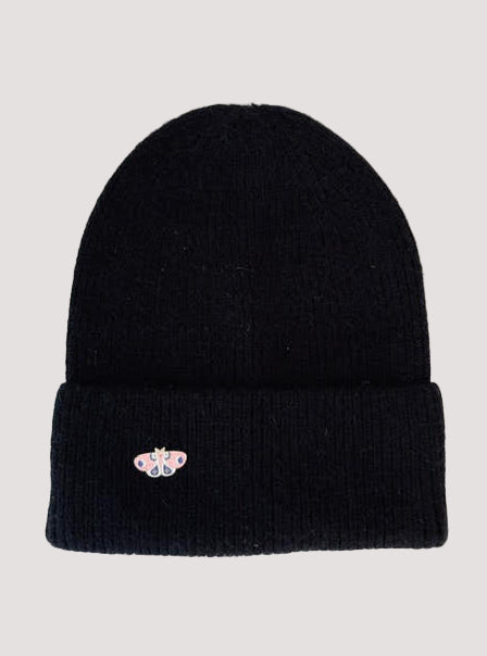 Black angora beanie with a butterfly brooch on a side.