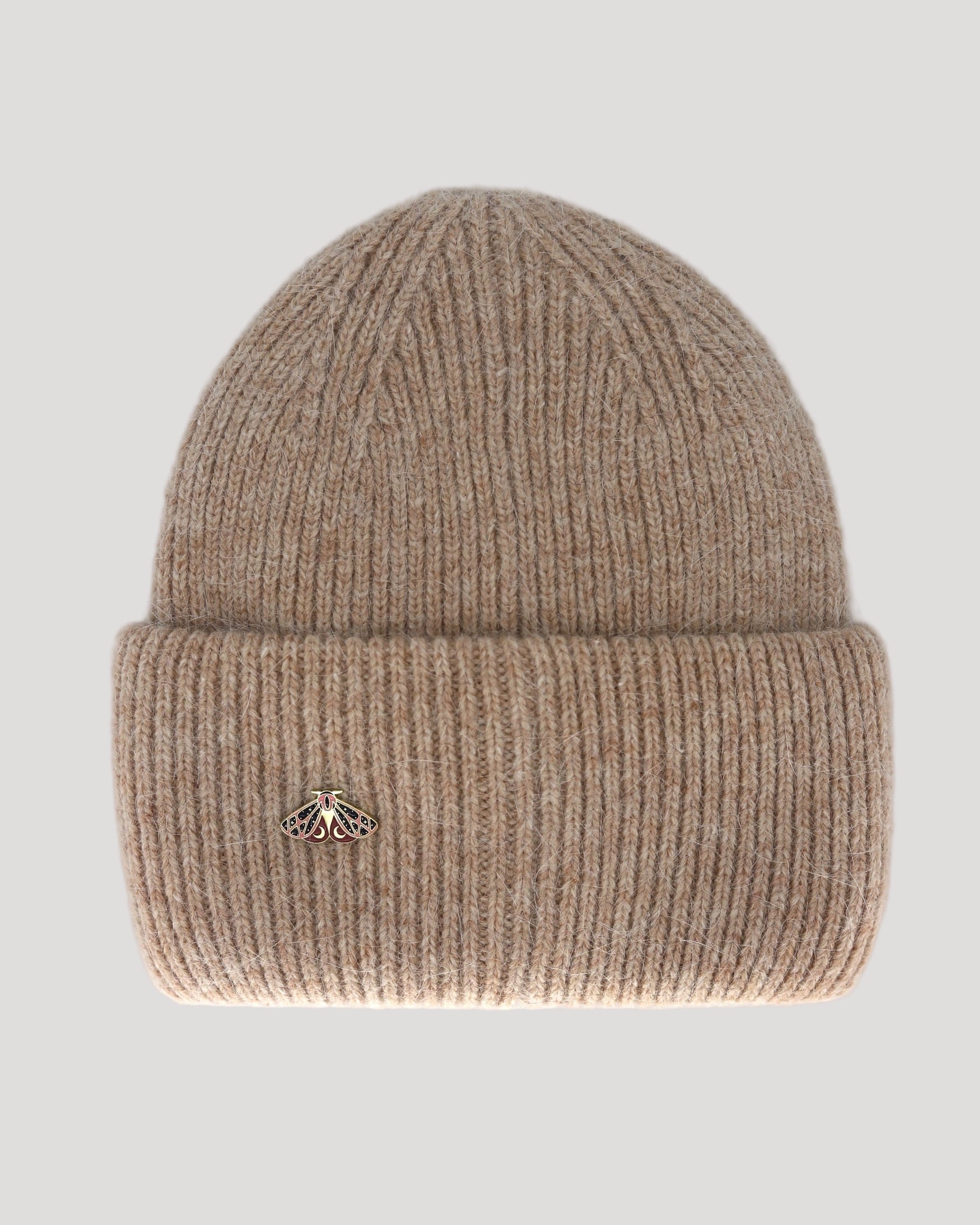 A beige beanie hat made of angora and wool, displayed on a neutral background.