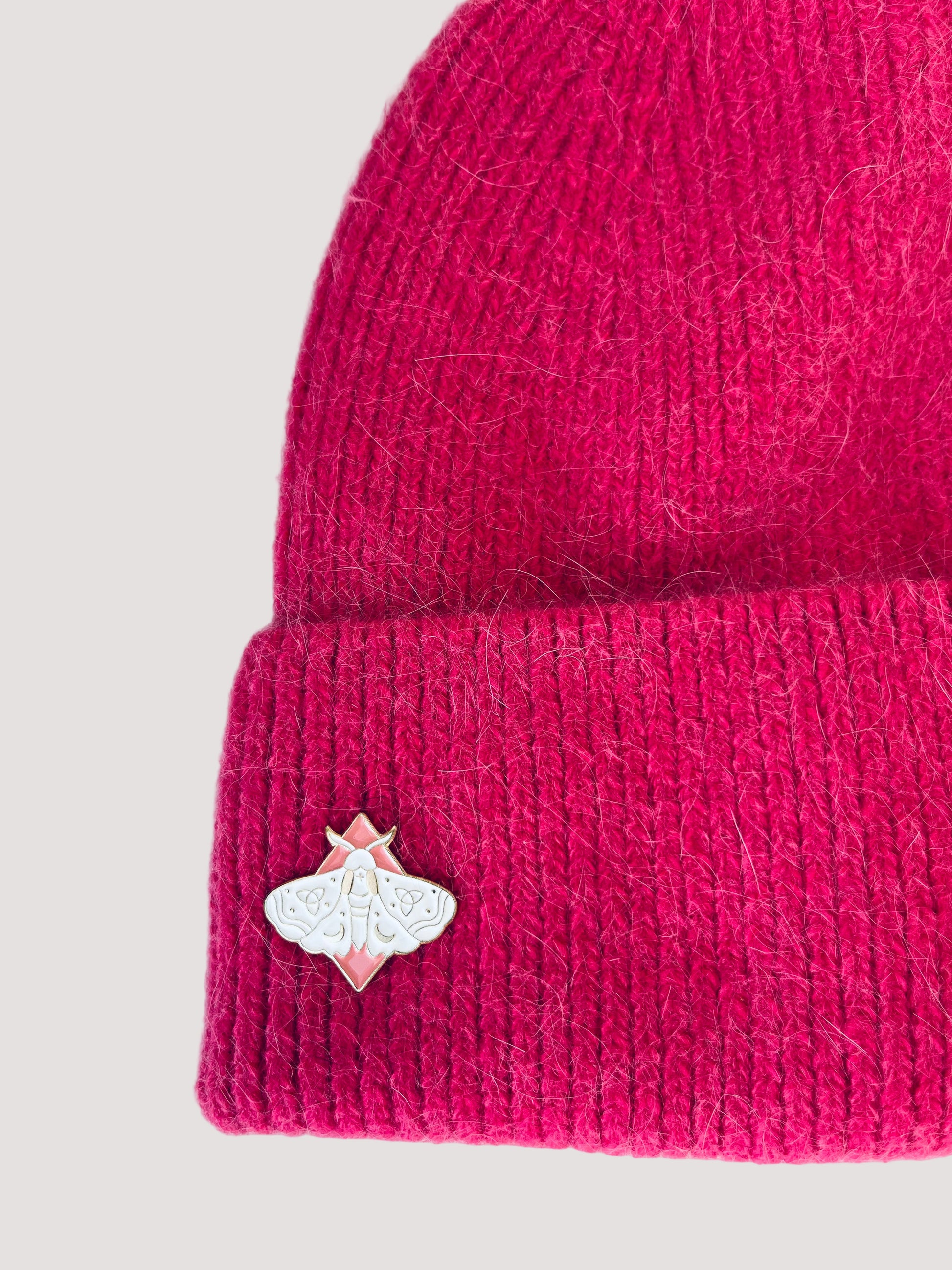 Pink knit angora pink beanie with an elegant butterfly pin on the side