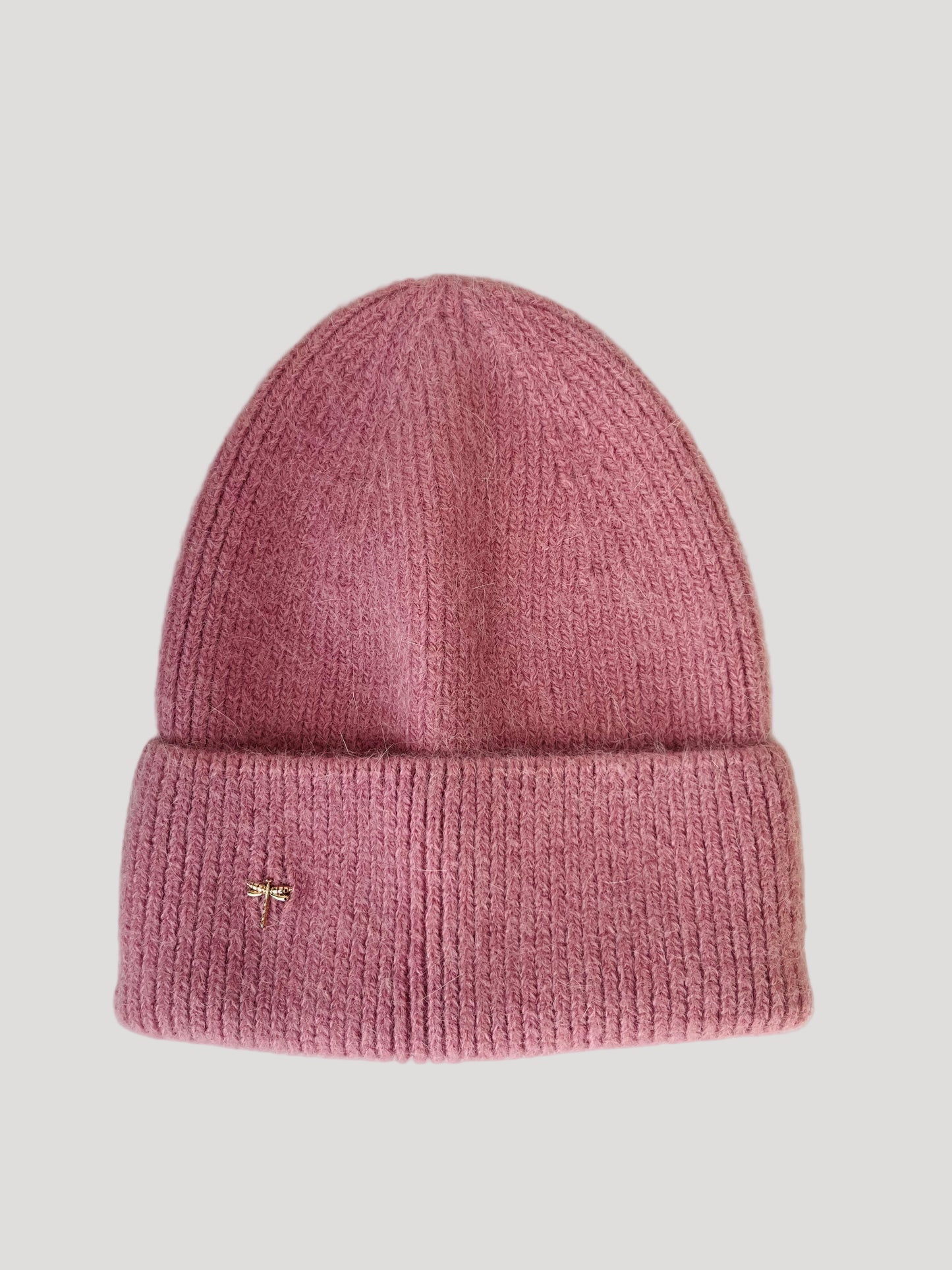 This Hat is a finest hat with a classic silhouette. A luxurious accessory for women made from the softest natural angora and sheep wool for extreme comfort and warmth. It is made in a trendy pale pink color accompanied by an elegant pin.