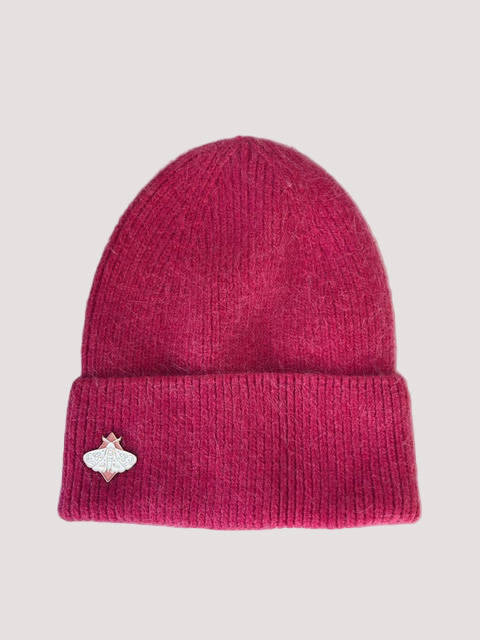 Pink knit angora pink beanie with an elegant butterfly pin on the side