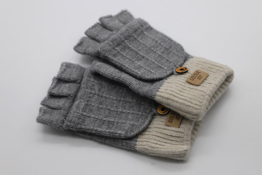 These flip-top gloves are finest gloves from Villanelle in medium gray. A comfortable and useful accessory for women made from the softest wool blend for extreme comfort and warmth. The opening and closing cover gives you flexibility to grab things easily and the closing cover will keep you warm on cold, winter, autumn, spring days. This product is sourced and manufactured in Poland.