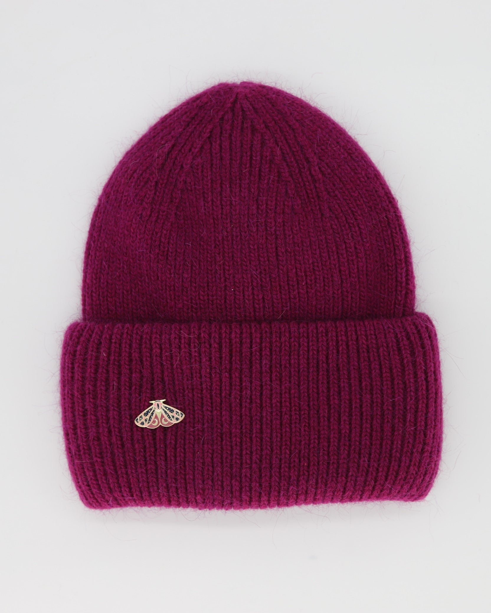 This Hat is a finest hat with a classic silhouette. A luxurious accessory for women made from the softest natural angora and sheep wool for extreme comfort and warmth. It is made in a trendy fuchsia color accompanied by an elegant pin. This product is sourced and manufactured in Poland.