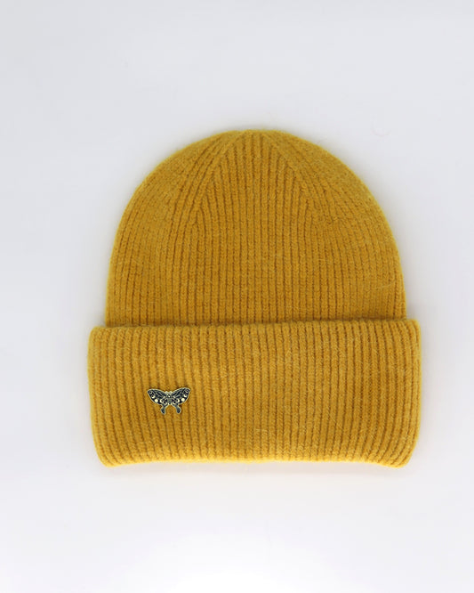 This Hat is a finest hat with a classic silhouette from Villanelle. A luxurious accessory for women made from the softest natural angora and sheep wool for extreme comfort and warmth. It is made in a trendy mustard yellow color accompanied by an elegant pin. This product is sourced and manufactured in Poland.
