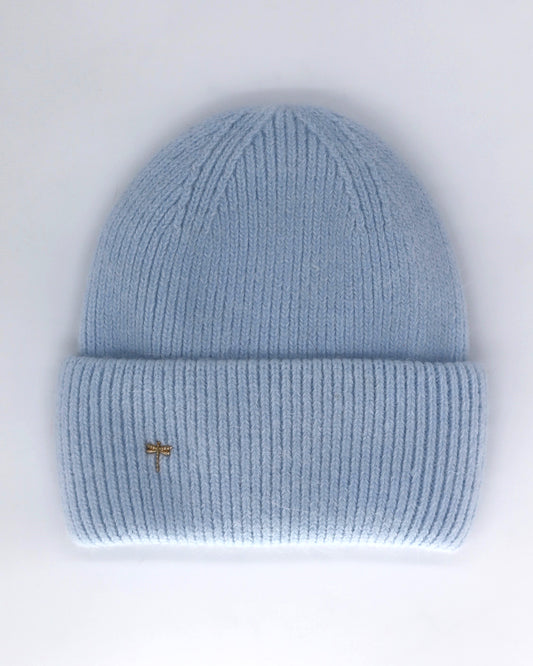 This Hat is a finest hat with a classic silhouette from Villanelle. A luxurious accessory for women made from the softest natural angora and sheep wool for extreme comfort and warmth. It is made in a trendy light blue color accompanied by an elegant pin. This product is sourced and manufactured in Poland.
