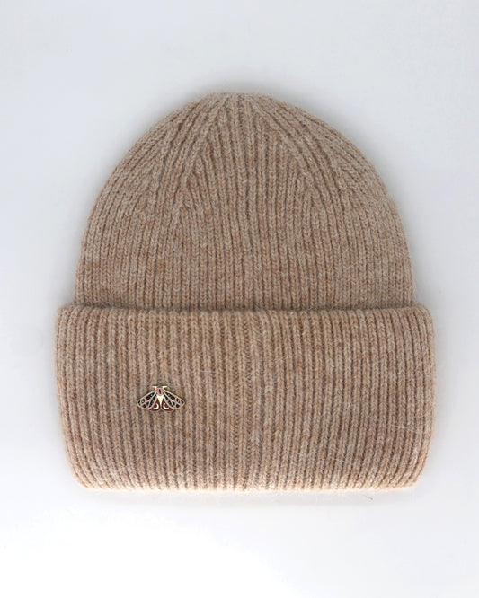 This Hat is a finest hat with a classic silhouette. A luxurious accessory for women made from the softest natural angora and sheep wool for extreme comfort and warmth. It is made in a trendy mocha beige color accompanied by an elegant pin. This product is sourced and manufactured in Poland.