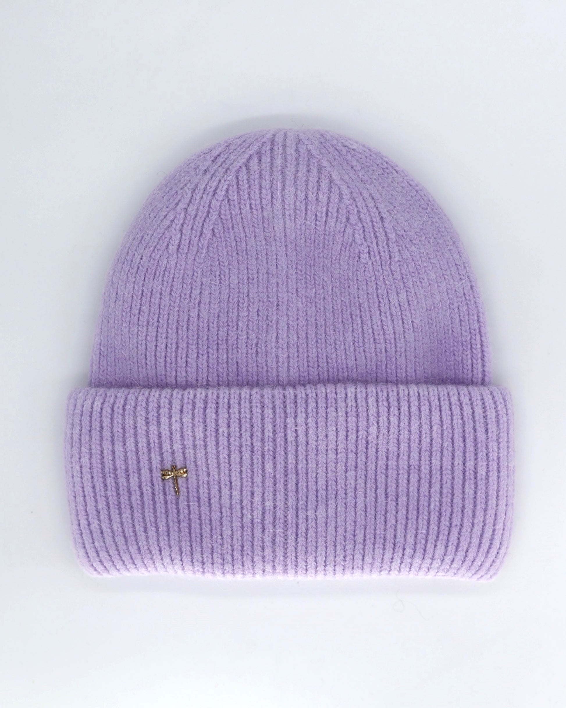 This Hat is a finest hat with a classic silhouette from Villanelle. A luxurious accessory for women made from the softest natural angora and sheep wool for extreme comfort and warmth. It is made in a trendy lavender color accompanied by an elegant pin. This product is sourced and manufactured in Poland.