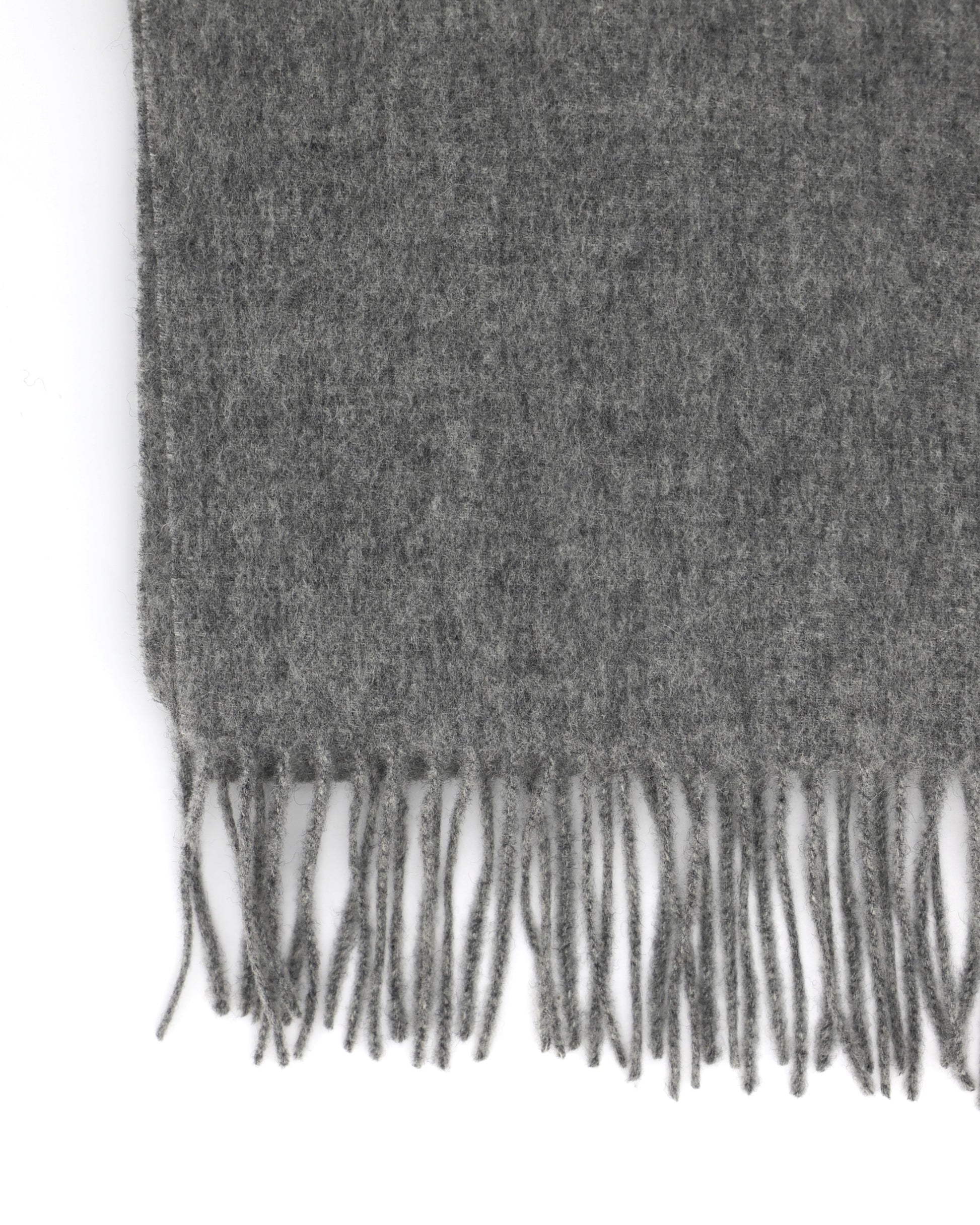 This Scarf is a finest 100% natural merino wool scarf from Villanelle. A luxurious and classic accessory for women and for men and made made from the softest natural merino wool in medium grey color for extreme comfort, warmth, a great look and feeling. This product is sourced in Italy and manufactured in Poland.
