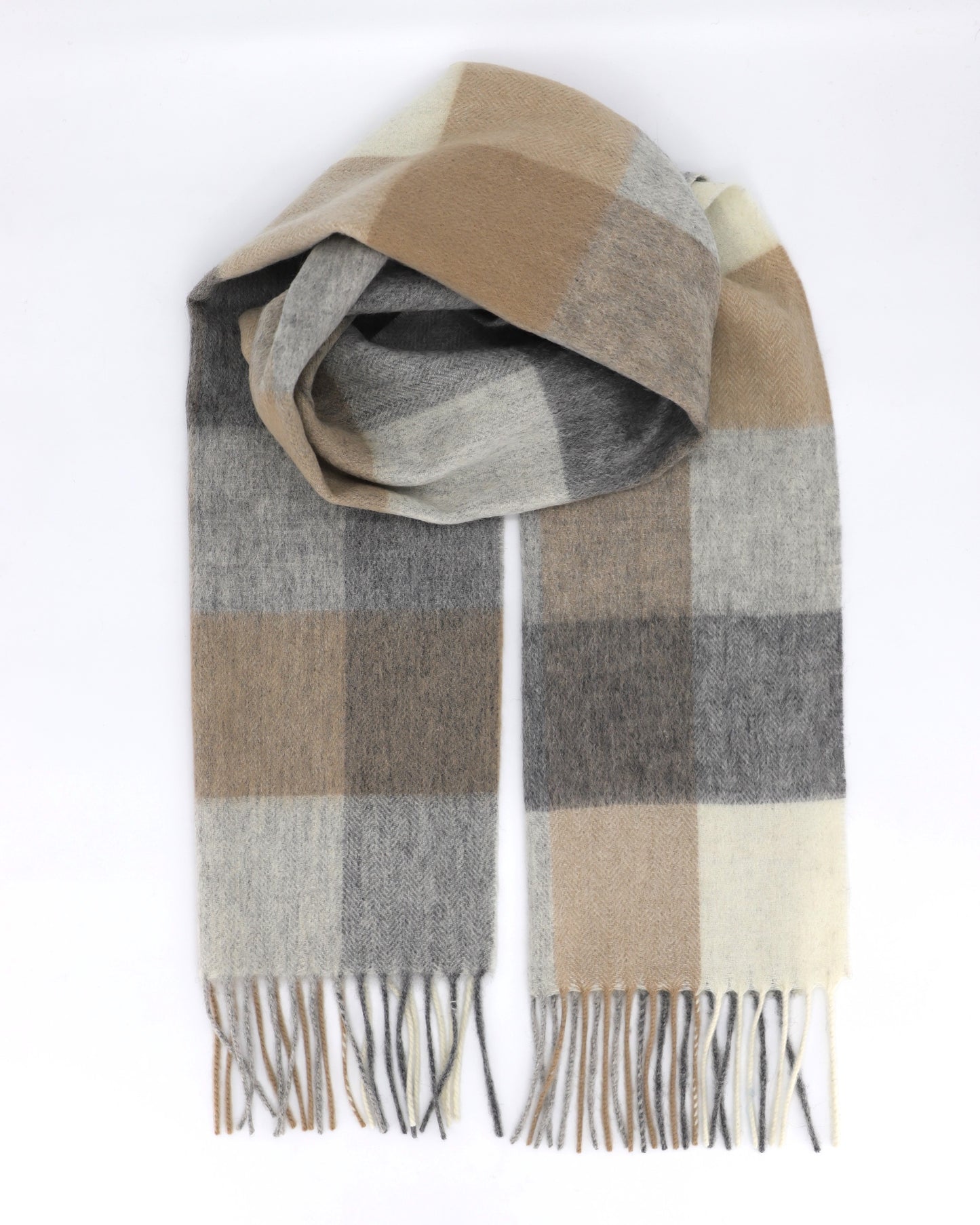 This Scarf is a finest 100% natural wool scarf in a classic checked pattern from Villanelle A luxurious accessory for women and made made from the softest natural wool for extreme comfort and warmth. It is made in a trendy combination of light grey, beige and creamy color. This product is sourced and manufactured in Poland.