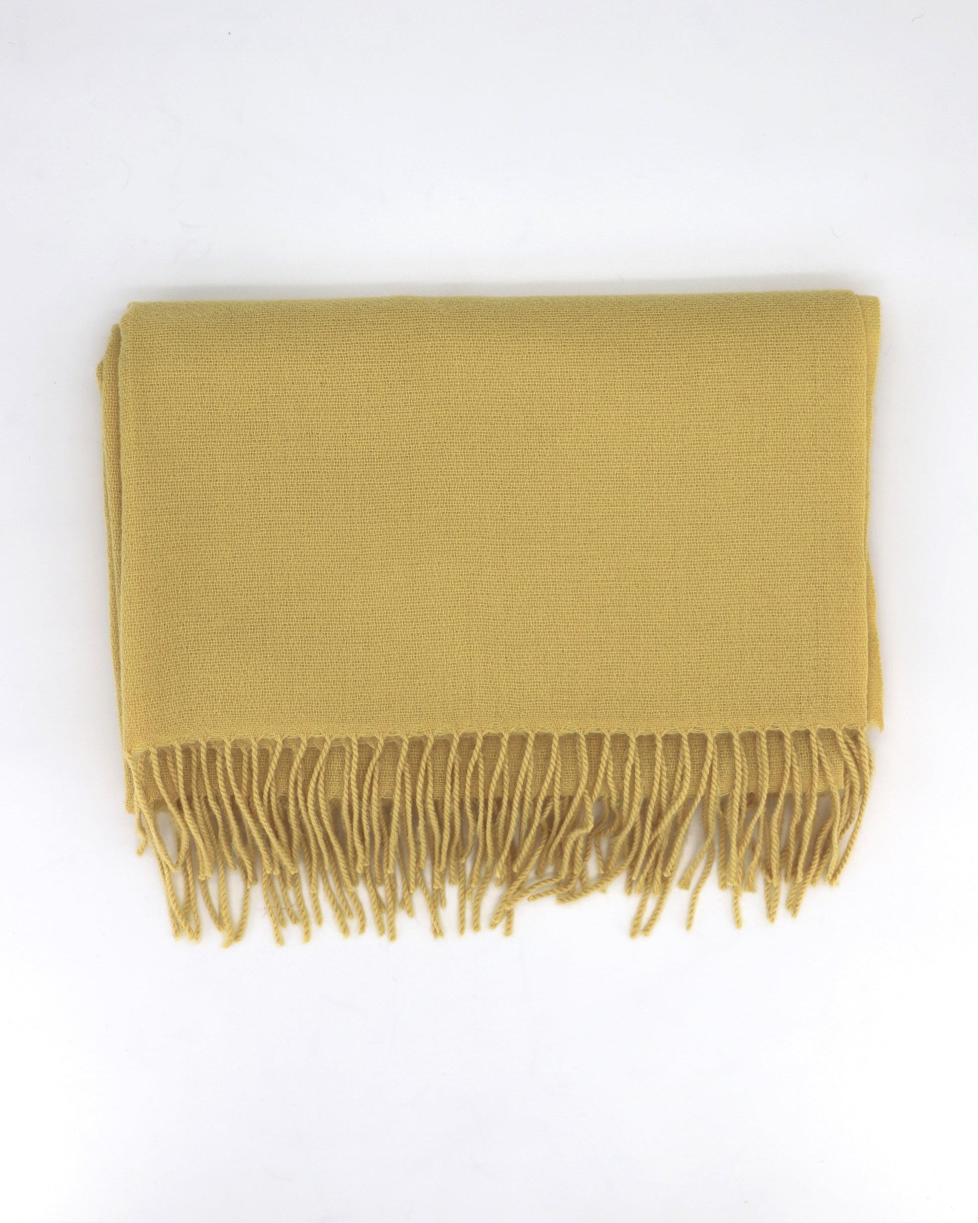 This Scarf is a finest XL-Size soft scarf from Villanelle. A luxurious accessory for women made from the softest wool and cashmere blend for extreme comfort and warmth. It is made in a trendy lemon yellow color for a great look and feeling. A cozy accessory for cold winter, autumn and spring days. This product is sourced and manufactured in Poland.