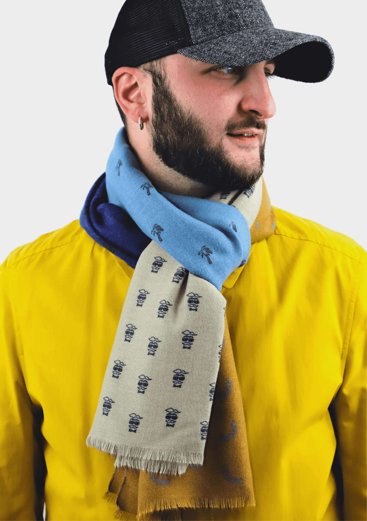 This is a soft and warm cotton scarf for men in vintage style in modern bananas, palms and moustache print in beige, brown, green and blue made of a special cotton blend that gives you a wonderful cashmere-like feeling without hurting animals. It is a vegan scarf certified by PETA and a perfect gift idea for men.
